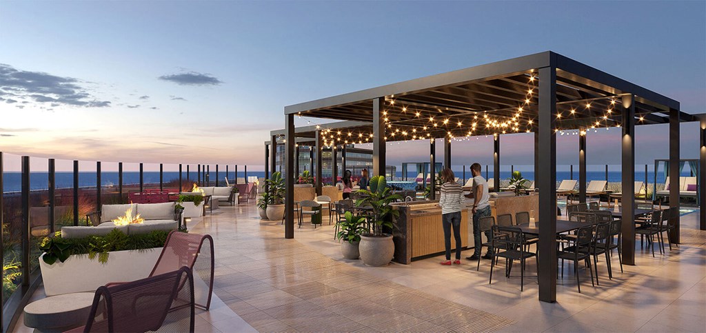 a rendering of the rooftop bar and restaurant at dusk