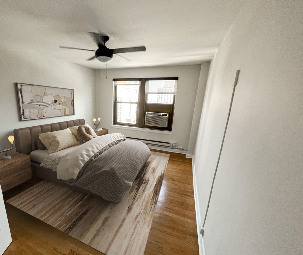 a bedroom with a bed and a ceiling fan