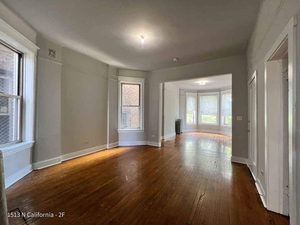 renovated living room and dining room of an empty house