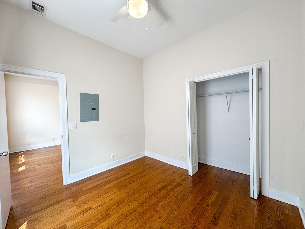 A room with wooden floors and white walls.