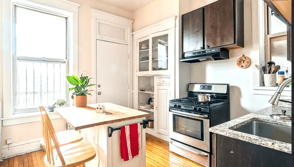 a small kitchen with a stove and a sink