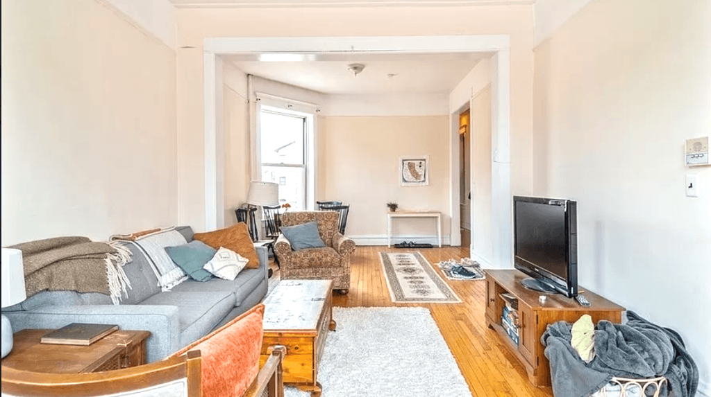 a living room with a couch and a tv