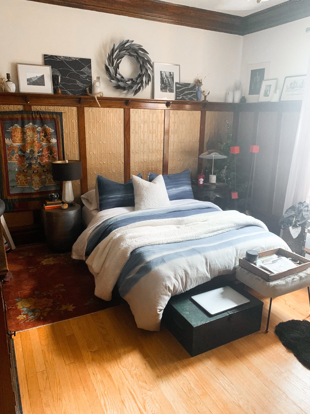 a bedroom with a bed and a table