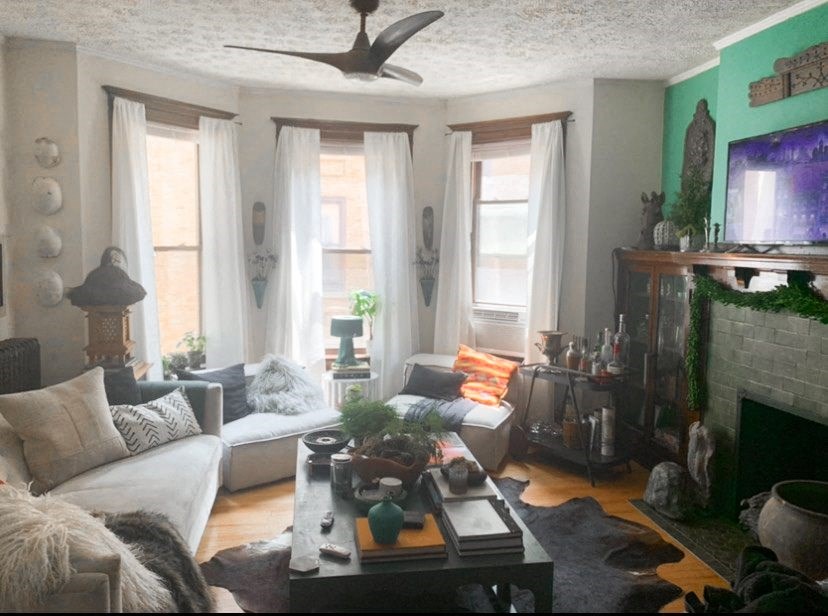 a living room filled with furniture and a fire place