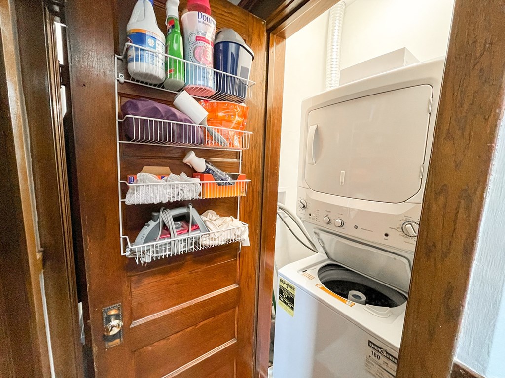A small laundry room with a washer and dryer.