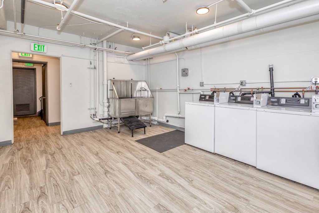 a large room with machines and a sink