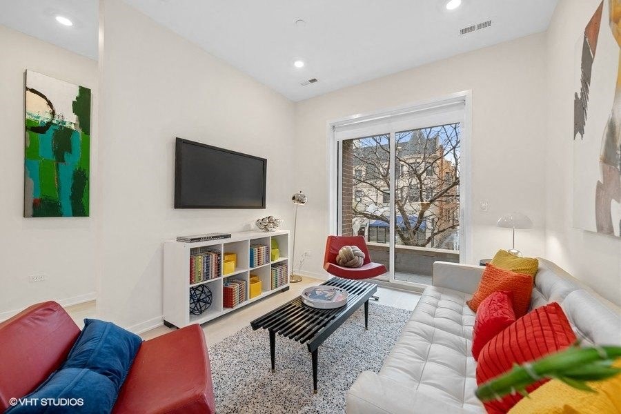 a living room with a couch and a television