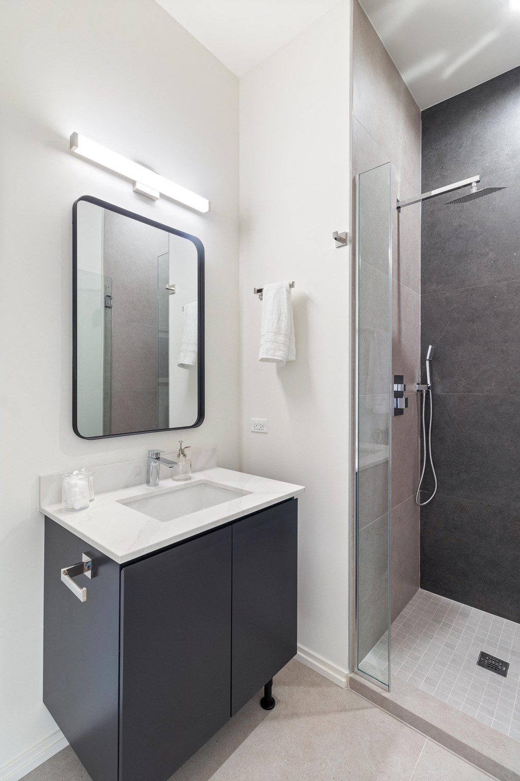 a small bathroom with a sink and a shower