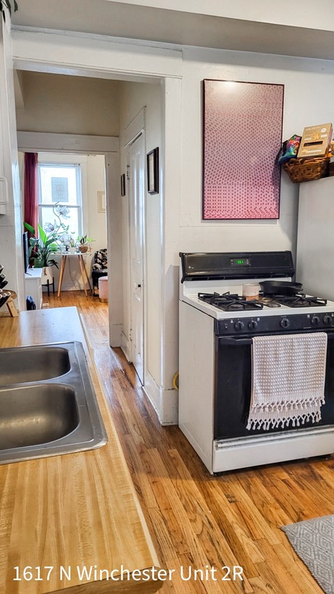 a kitchen with a stove and a sink