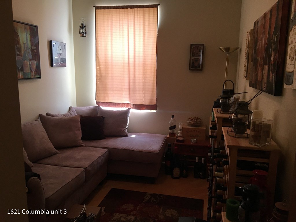 a living room with a couch and a window