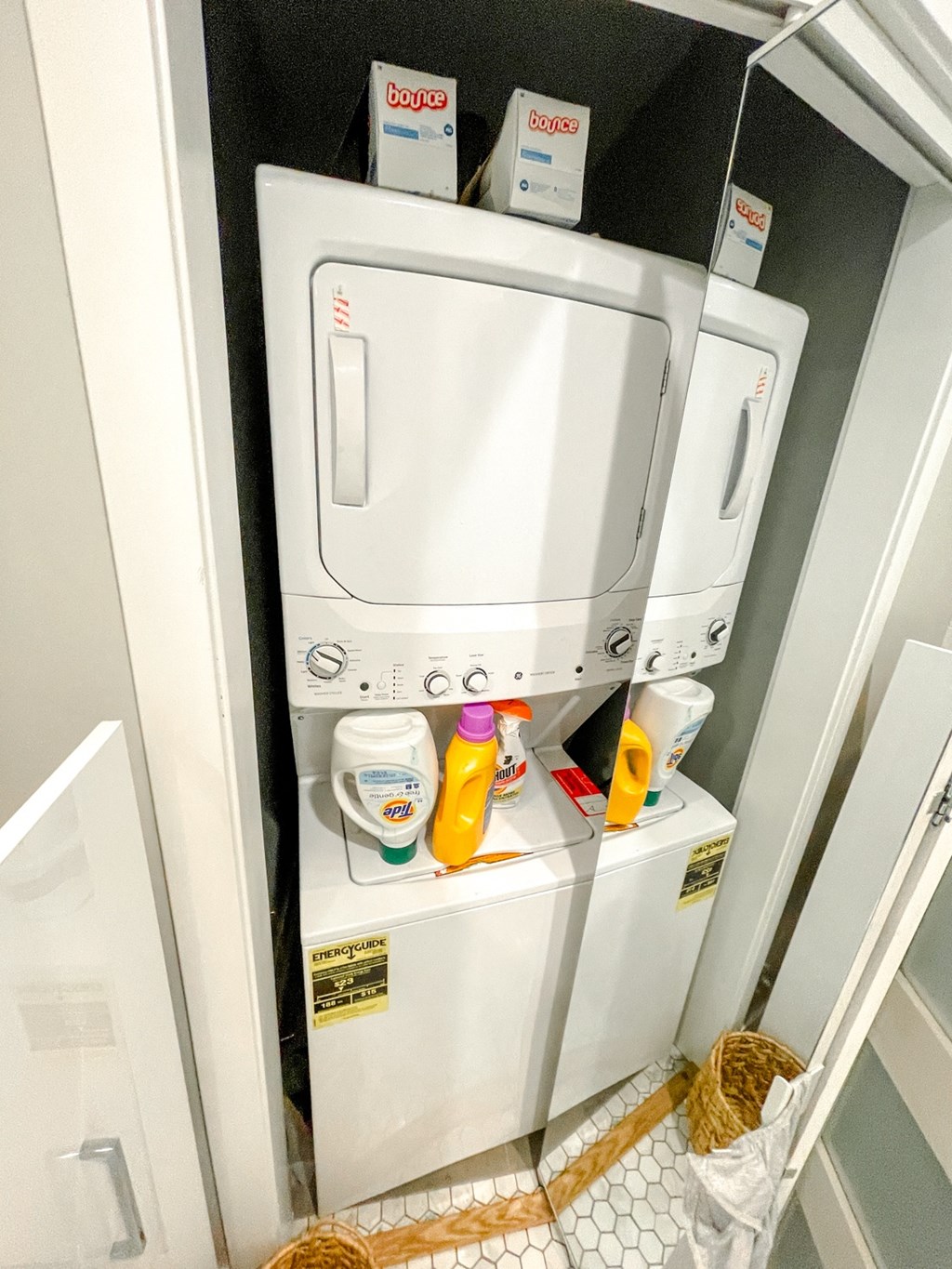 a washer and dryer in the closet of a hotel room