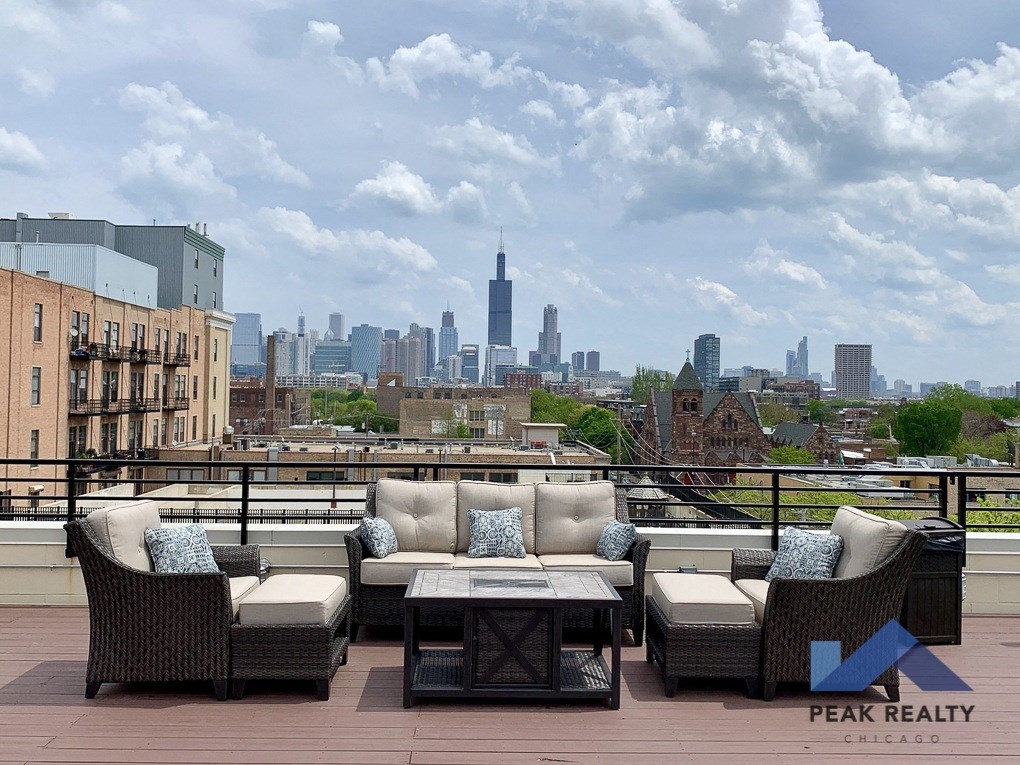 a view of the chicago skyline from a roof deck