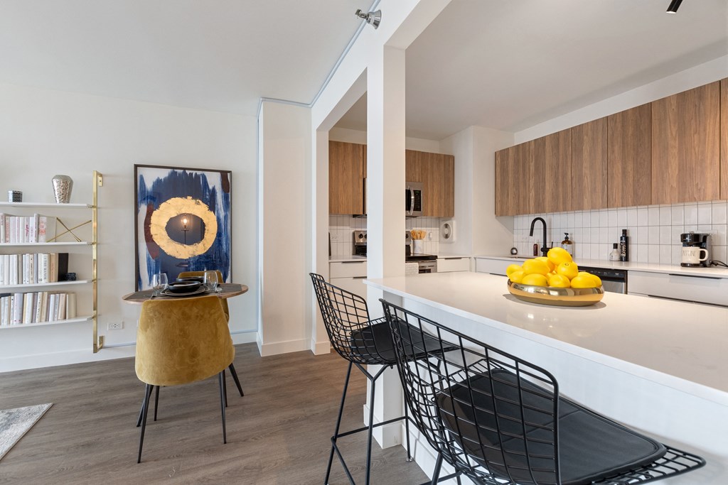 A closeup of a kitchen and dining area in a 1250 LaSalle apartment