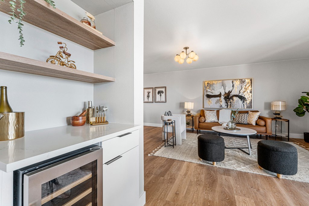 a living room and a kitchen with a couch and a table