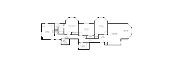 A floor plan of a house with a kitchen, living room, and two bathrooms.
