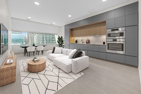 a large living room with a white couch and a table