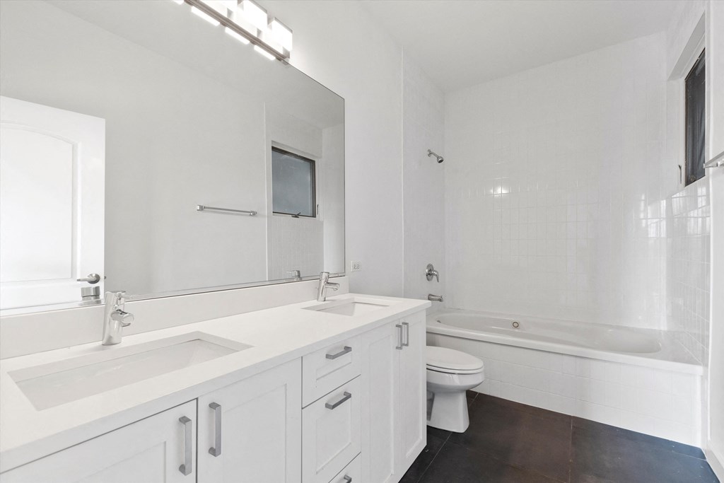 a bathroom with a toilet sink and bathtub