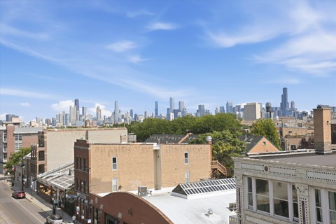 A cityscape with buildings and a clear sky.