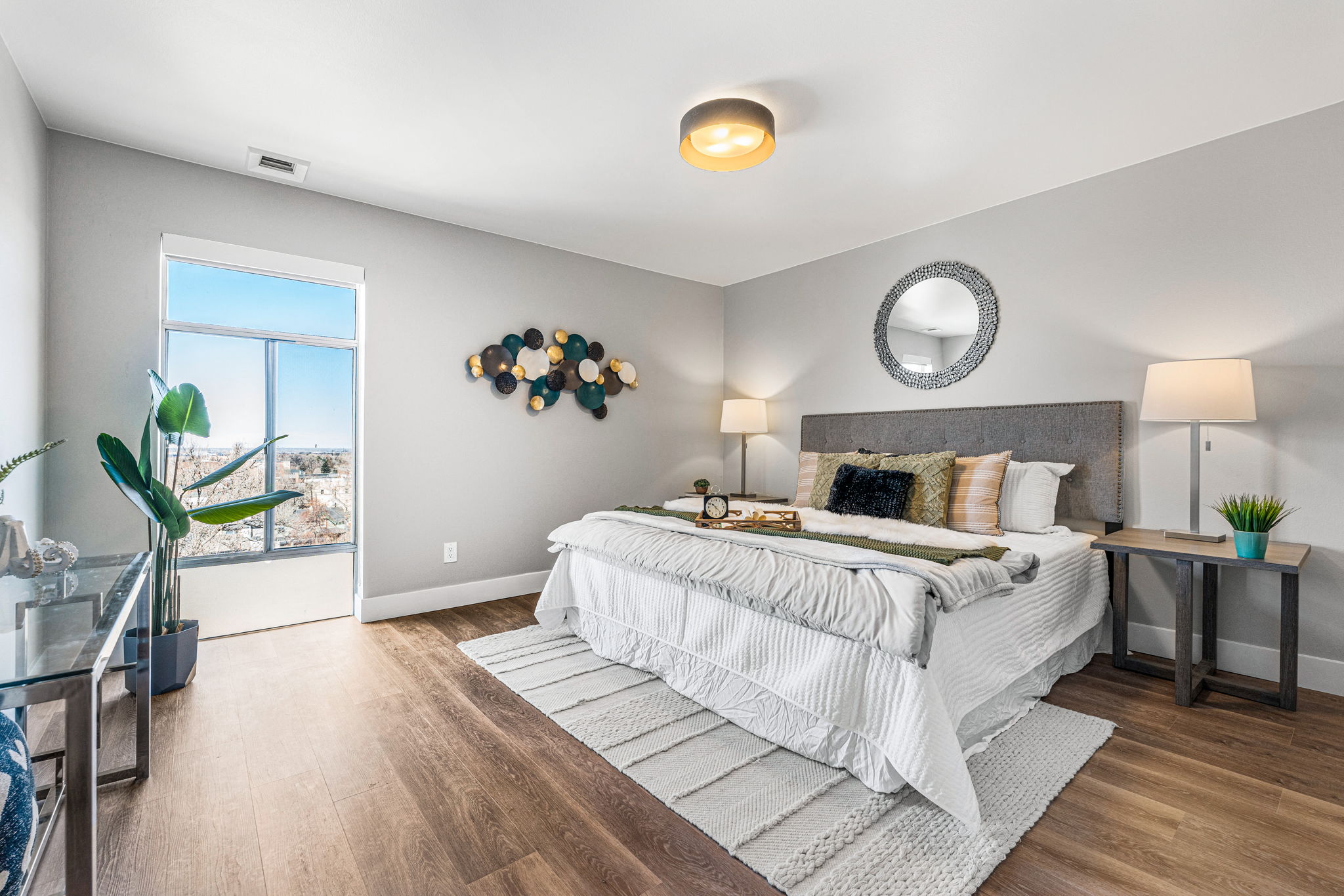 a spacious bedroom with a large bed and a window