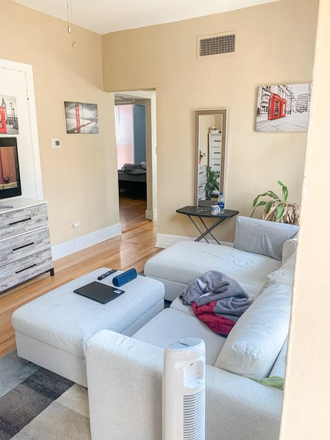 a living room with a couch and a tv