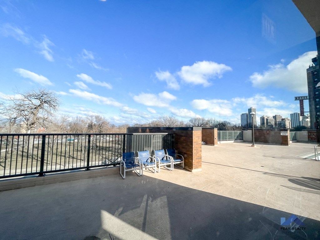 the deck on the top of the building has a view of the city