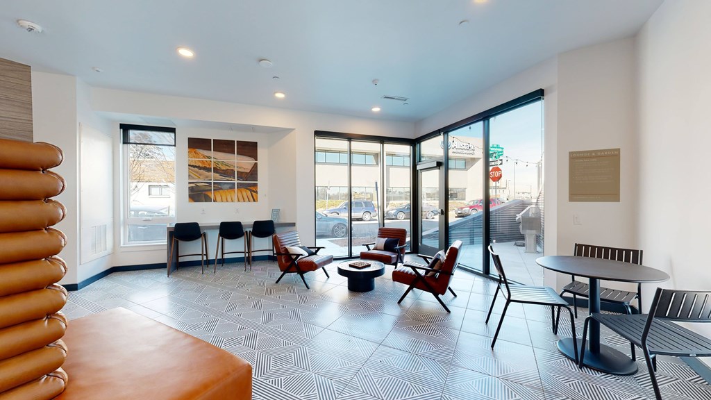 A modern waiting room with a view of the street outside.