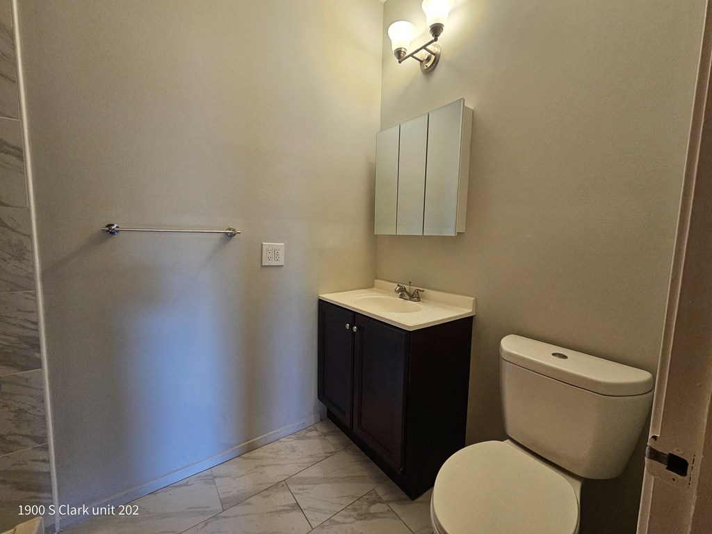 a small bathroom with a toilet and a sink