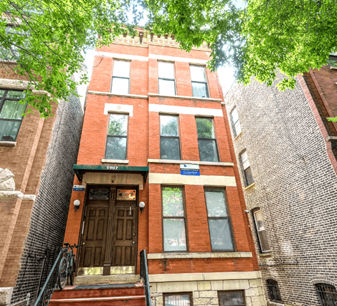 a tall brick building with a wooden door
