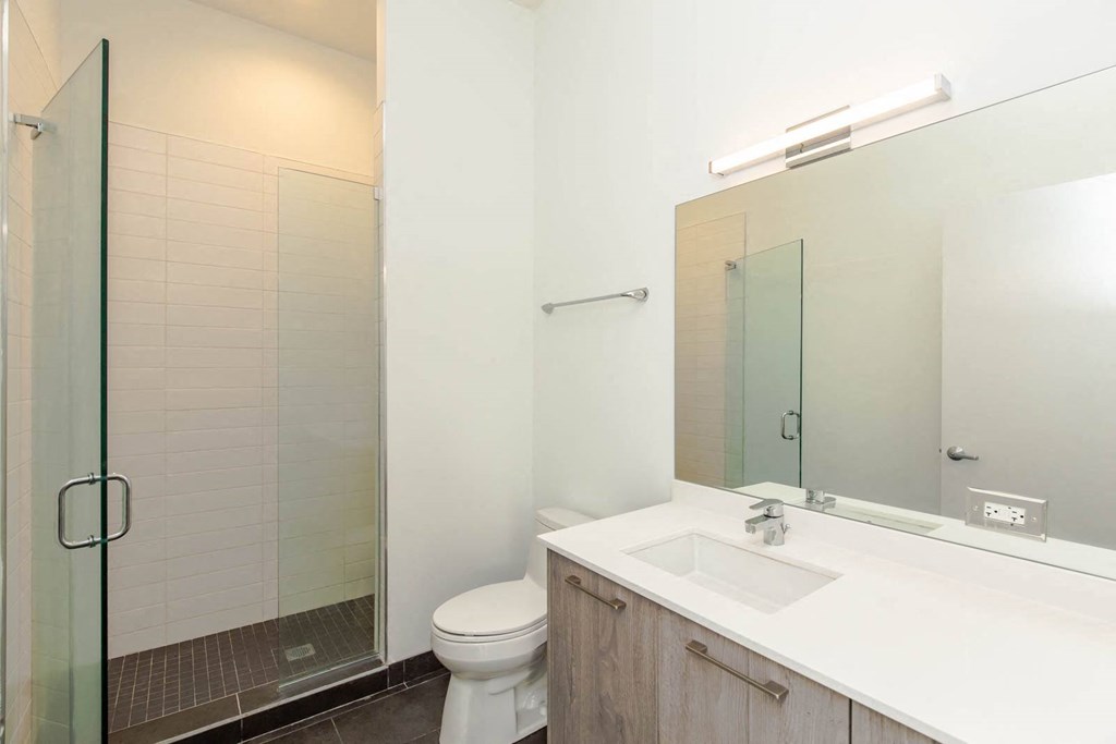 a bathroom with a sink toilet and a shower