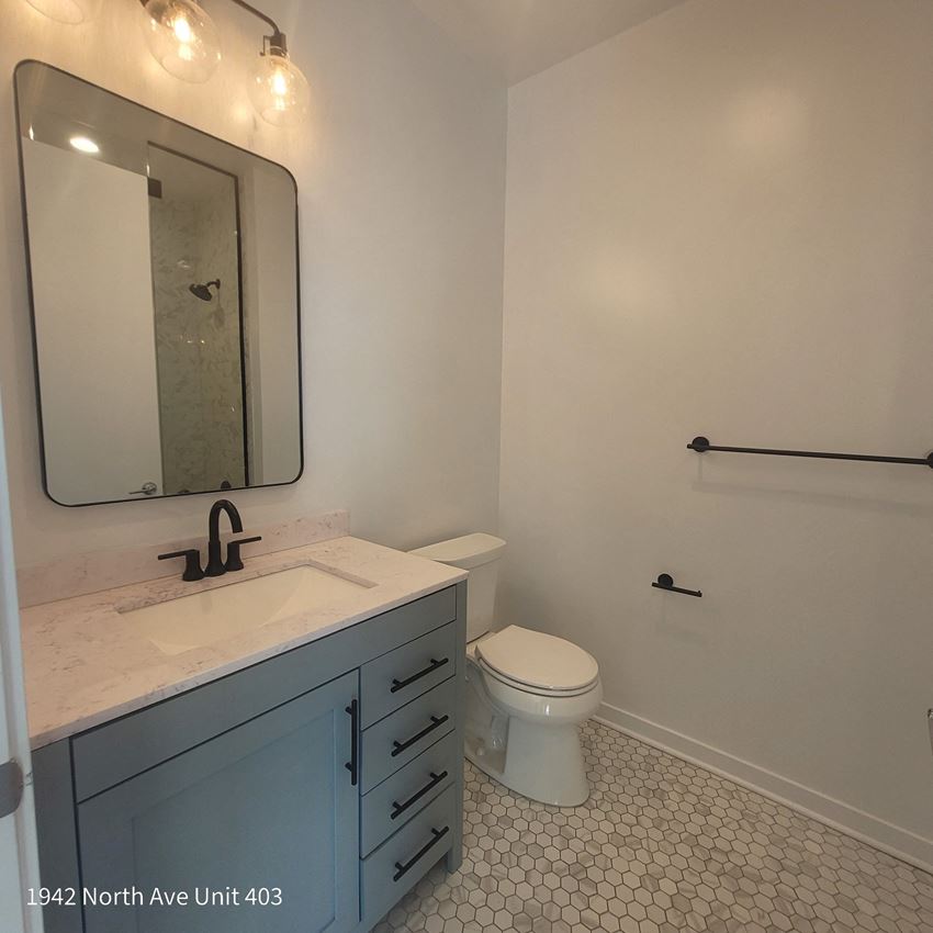 a bathroom with a sink and a toilet - Photo Gallery
