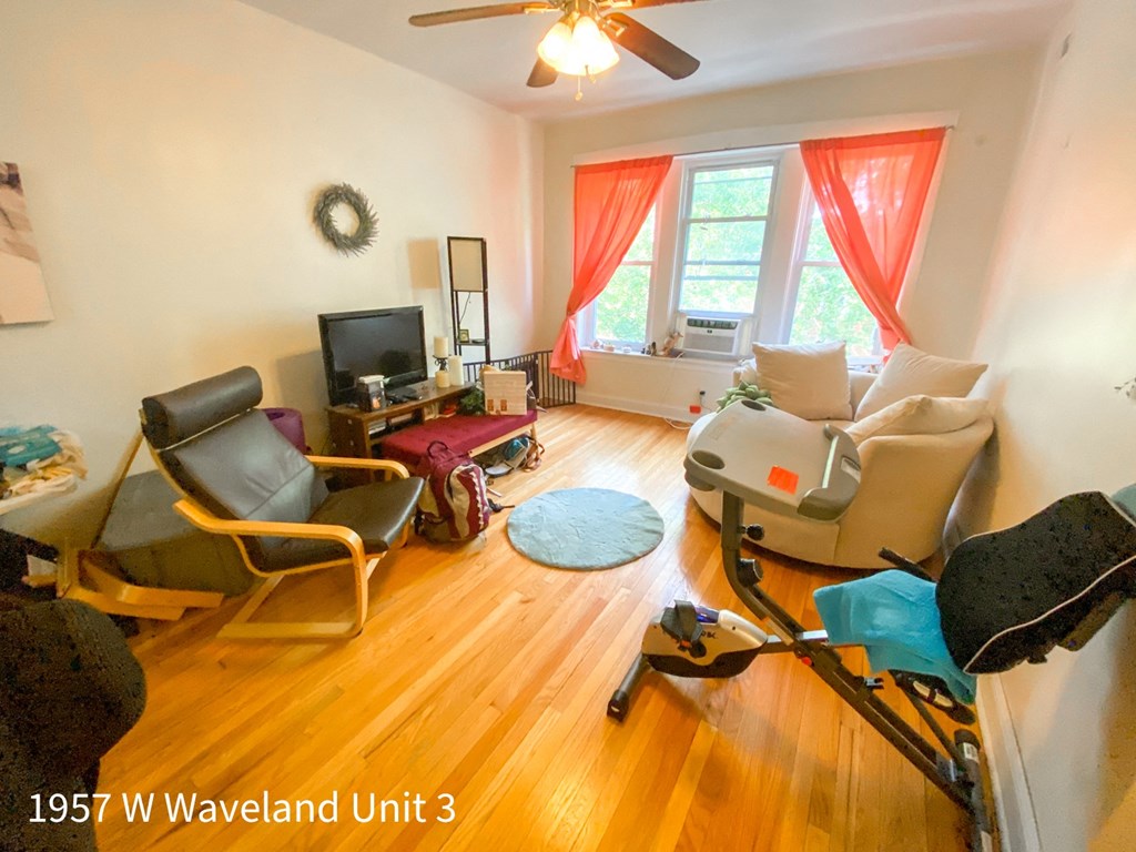 an image of a living room with furniture and a tv