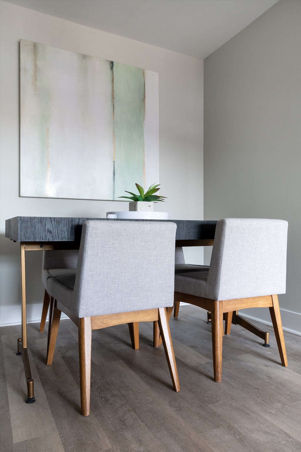 a dining room with a table and chairs