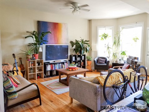 a living room with a bike in front of the tv