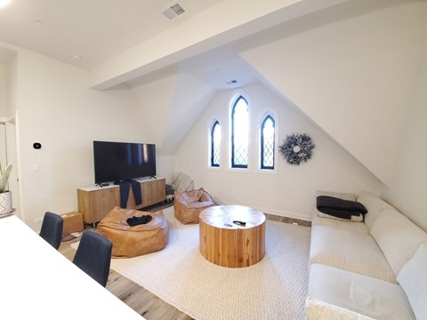 a living room with a couch and a tv