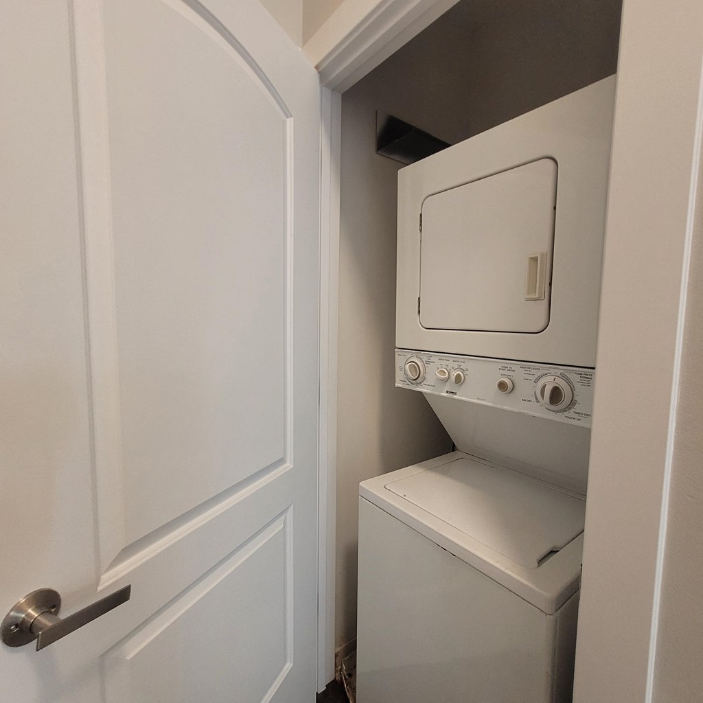 a small laundry room with a washer and dryer