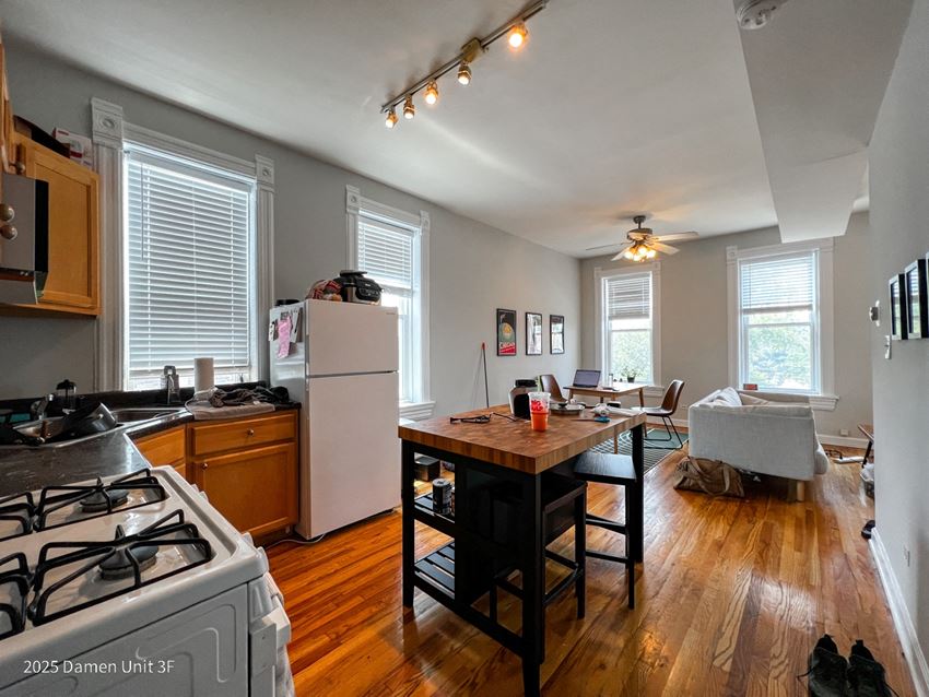 a view of the kitchen and living room from the dining room