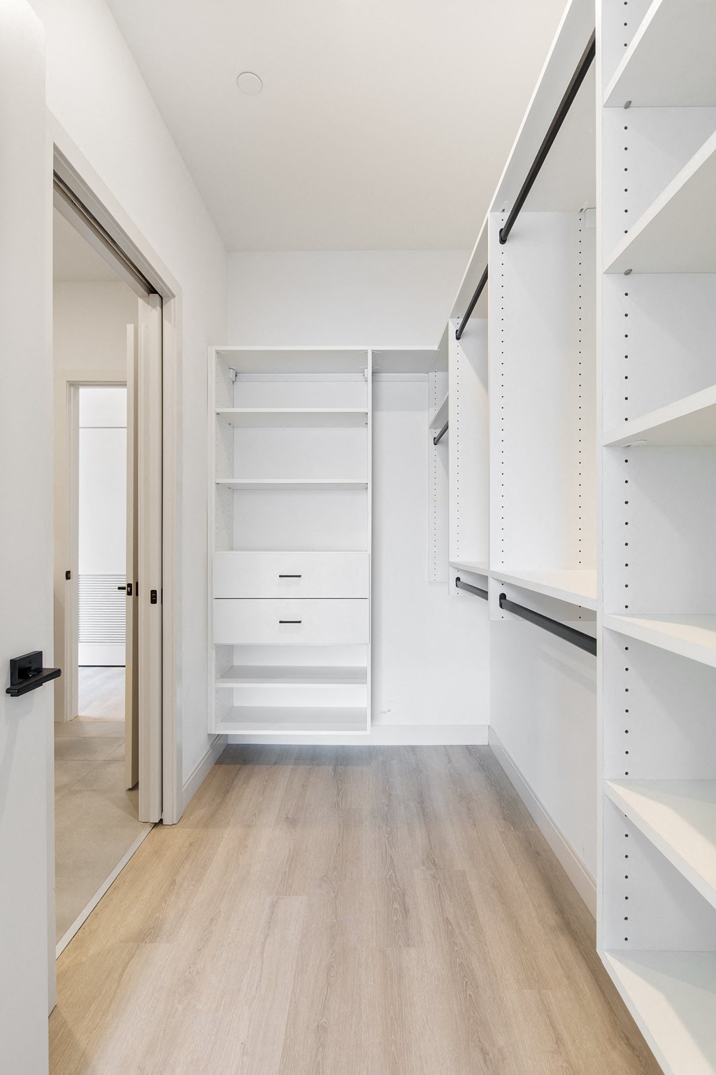 a walk in closet in a 555 waverly unit