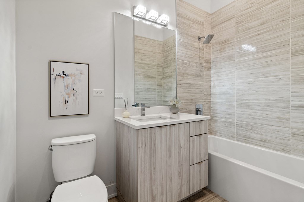 a bathroom with a toilet sink and bathtub