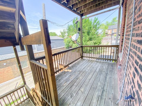 a view of the balcony from the back of the house