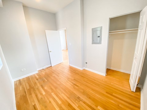 A room with wooden floors and white walls.