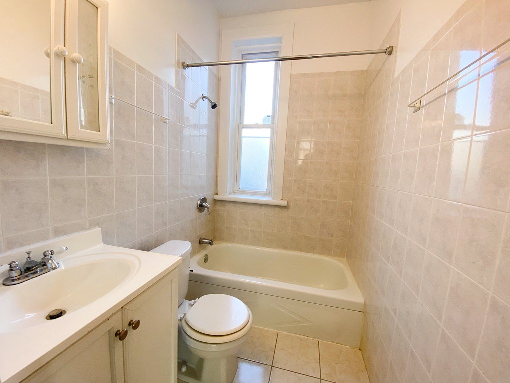 a bathroom with a sink toilet and a bath tub