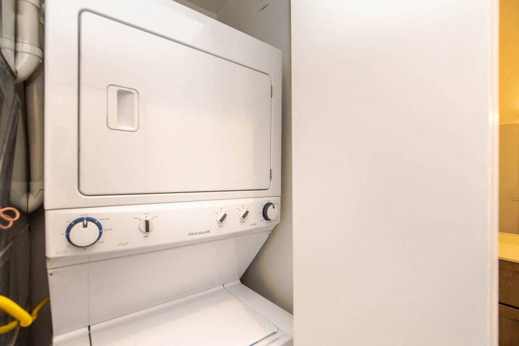 a white washer and dryer in a laundry room