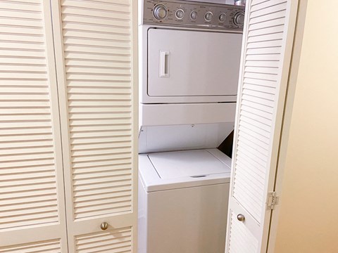 the laundry room has a washer and dryer and plenty of closet space