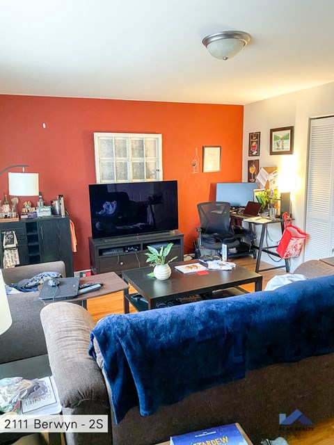 a living room with a couch and a television