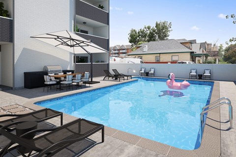 a swimming pool with a pink flamingo in the middle of it