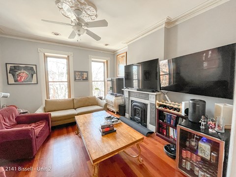 a living room with a couch and a coffee table and a television