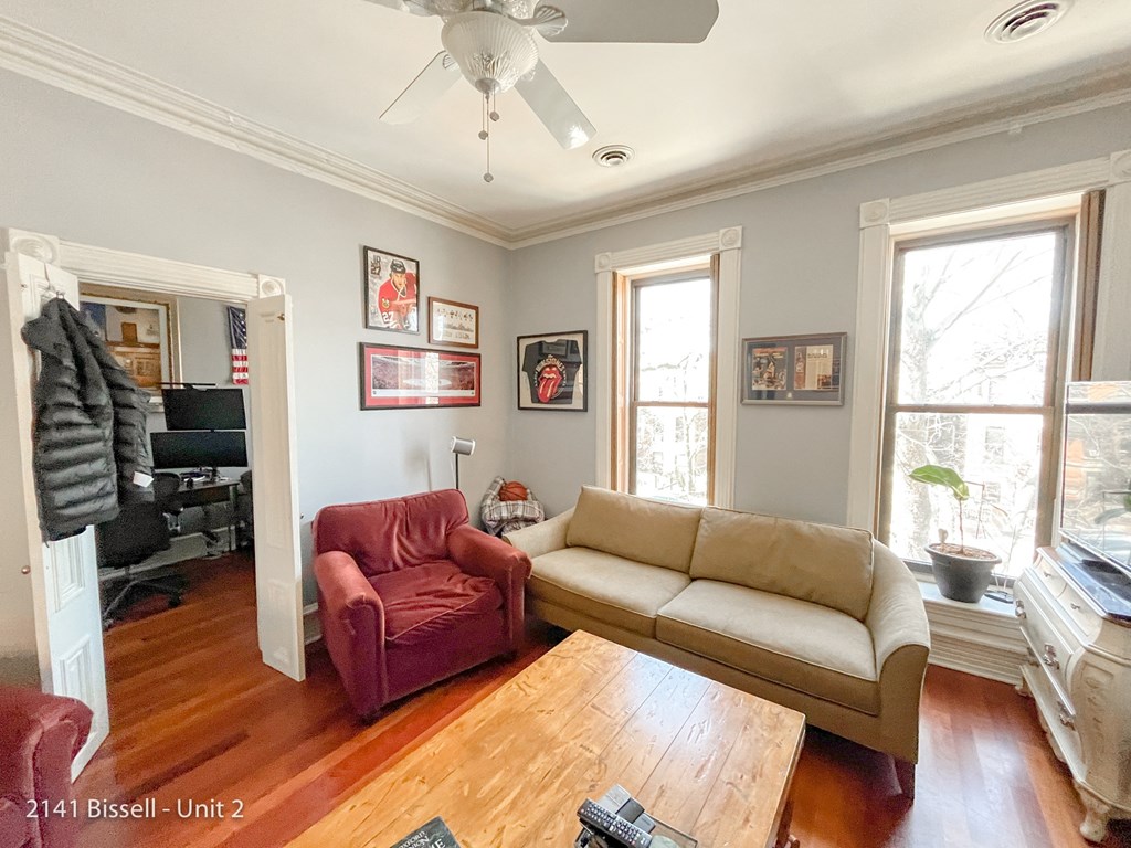 a living room with a couch chair and a coffee table