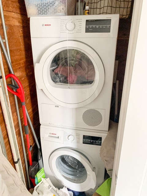 a washing machine and dryer in a small room