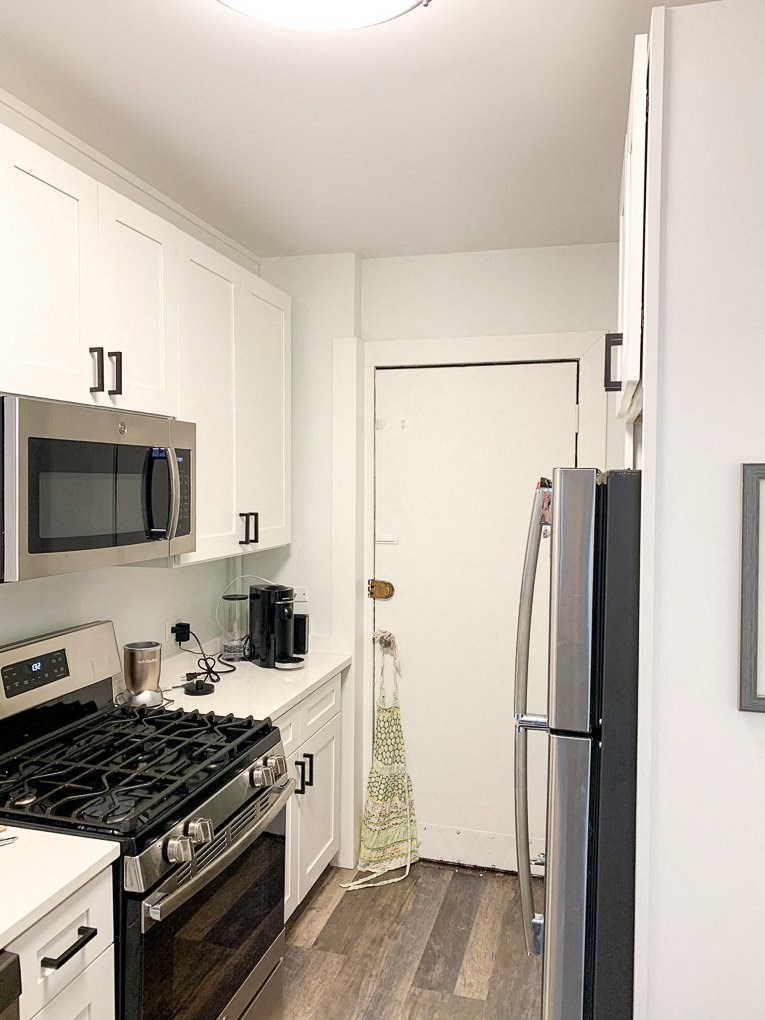 a kitchen with a stove and a refrigerator