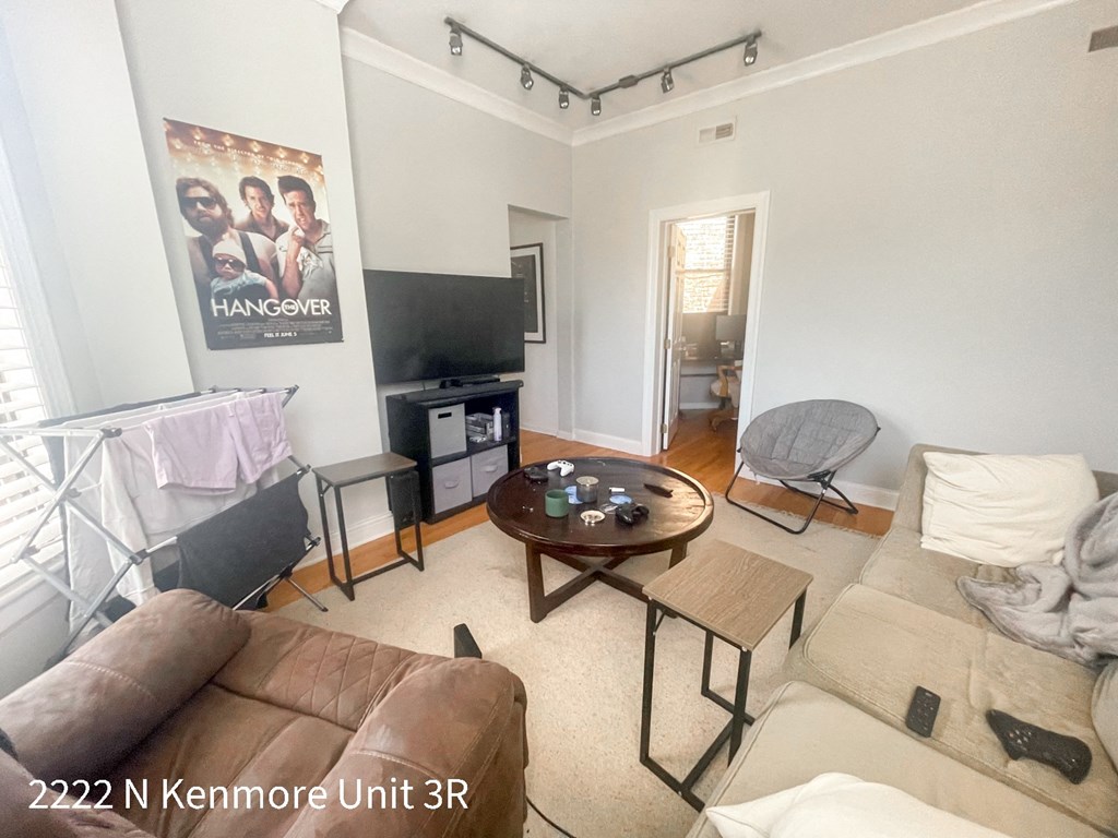 a living room with a couch and a tv